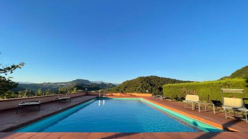 a swimming pool on the roof of a house at Val di Codena - Holiday Home 