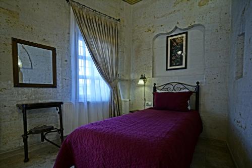 Кровать или кровати в номере Vista Cave Hotel