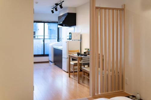 Ένα ή περισσότερα κρεβάτια σε δωμάτιο στο HANASTAY花渓居 · 松（MATSU)