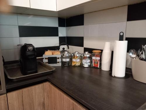 a kitchen counter with a counter top with a counter top at Rome 66 apartments in Rome