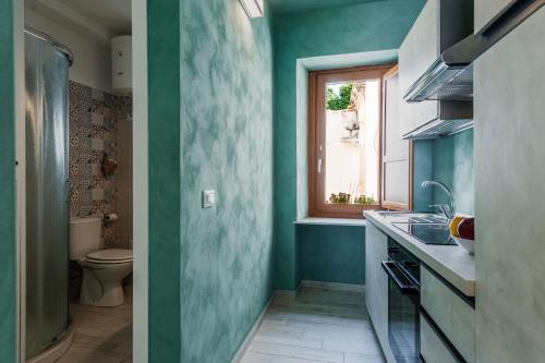 A bathroom at Five Stars Sicily by Ortigia Apartments