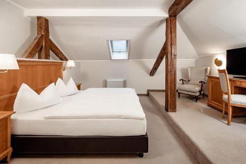 Postel nebo postele na pokoji v ubytování Classic Hotel Meranerhof