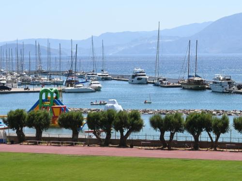 a marina with a bunch of boats in the water at Efi's Luxury Suite in Agios Nikolaos