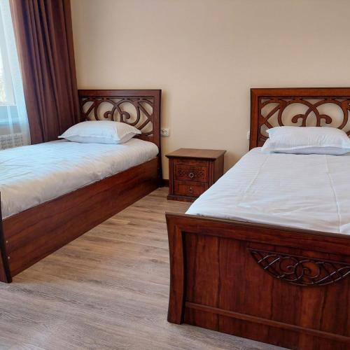 Кровать или кровати в номере Samarabonu Hotel