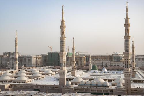 a view of a mosque with minarets and domes at Sofitel Shahd Al Madinah in Al Madinah