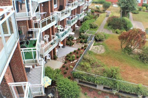 an aerial view of an apartment building with a garden at Residenz Kormoran 1 0 in Cuxhaven
