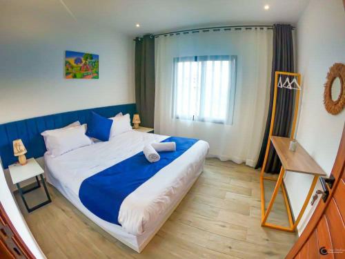 Una cama o camas en una habitación de Yvanka Appart'City Antsirabe