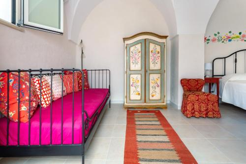 Ένα ή περισσότερα κρεβάτια σε δωμάτιο στο La Costantina Casa Vacanze