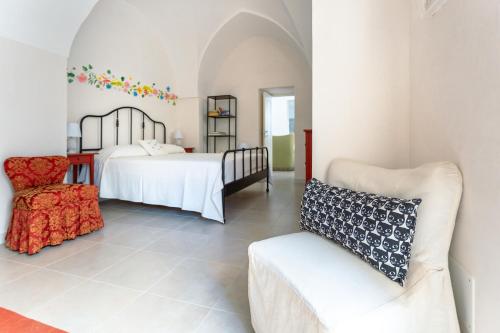 Ένα ή περισσότερα κρεβάτια σε δωμάτιο στο La Costantina Casa Vacanze