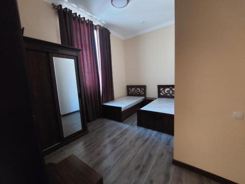 Кровать или кровати в номере Samarabonu Hotel