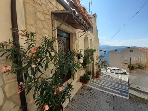 a building with plants in front of a door at Porta del Colle in Roccavivara