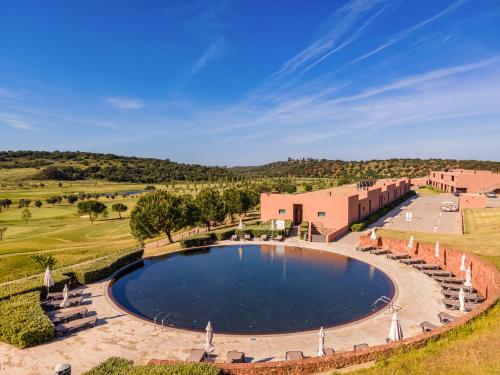 an overhead view of a pool at aitage resort at NAU Morgado Golf & Country Club in Portimão