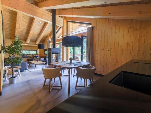 a dining room with a table and chairs at Chalet One Jasná in Demanovska Dolina