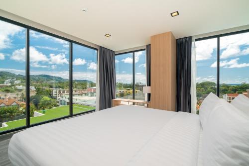 Postel nebo postele na pokoji v ubytování Grand Kata VIP - Kata Beach