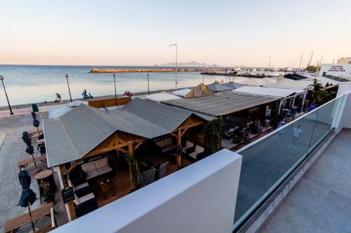 a restaurant on a building near the beach at Chrysoula seaside apartment in Kardamaina