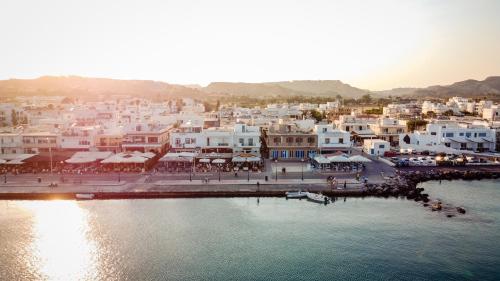 a city with white buildings and a body of water at Chrysoula seaside apartment in Kardamaina