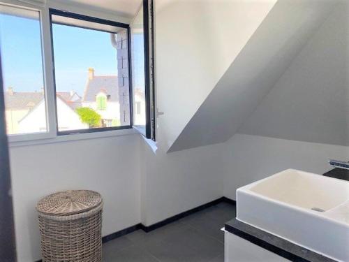 a white bathroom with a sink and a window at Villa Quiberon, 5 pièces, 8 personnes - FR-1-478-205 in Quiberon