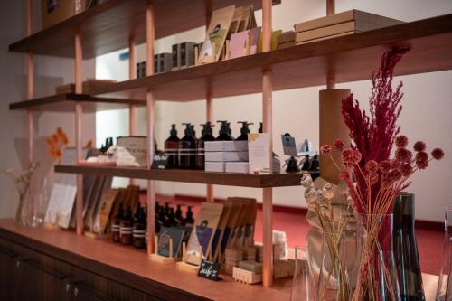 a shelf filled with bottles of wine on a counter at Hotel Schweizerhof Lenzerheide in Lenzerheide