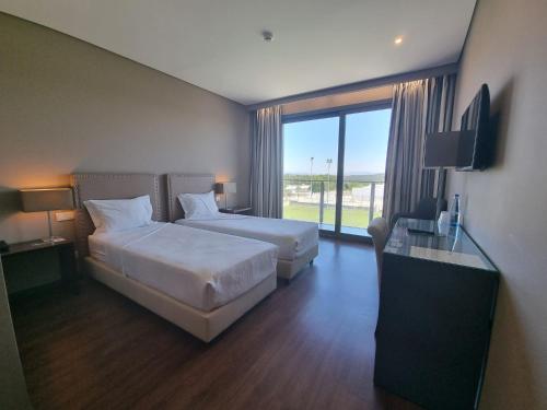 Ένα ή περισσότερα κρεβάτια σε δωμάτιο στο Casa do Adro Hotel de Charme