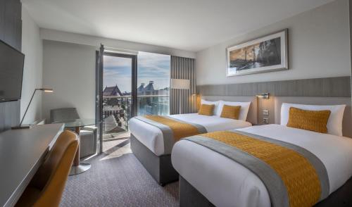 Cama ou camas em um quarto em Maldron Hotel Smithfield Dublin City