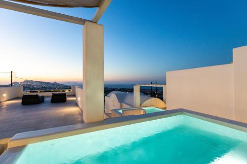 a swimming pool on the roof of a house at SERAPIAS SUITES in Éxo Goniá