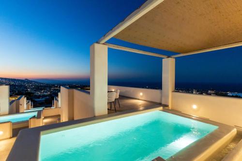 a swimming pool on the roof of a house at SERAPIAS SUITES in Éxo Goniá