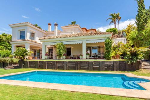 The swimming pool at or close to Ocean Views Luxury Villa next to beach