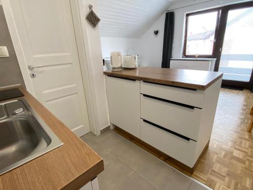 a kitchen with a sink and a counter top at Studio Tara with balcony in Bled