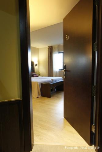 Hotel Torre de Núñezにあるベッド