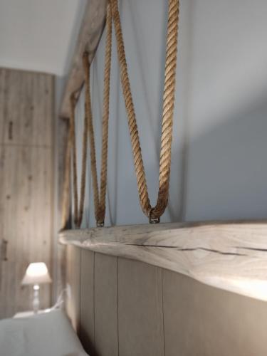 a row of ropes hanging from a wall in a room at VILLA KALDERA in Skiathos Town