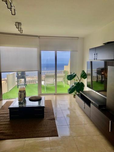 a living room with a view of the ocean at MIRADOR DE MERESE in Frontera