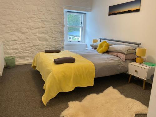 Ένα ή περισσότερα κρεβάτια σε δωμάτιο στο Hartfield House Hostel