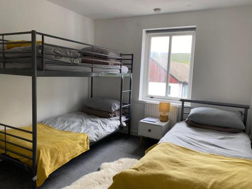 Ένα ή περισσότερα κρεβάτια σε δωμάτιο στο Hartfield House Hostel