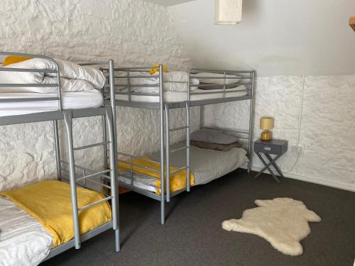 Ένα ή περισσότερα κρεβάτια σε δωμάτιο στο Hartfield House Hostel