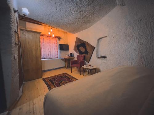 Ένα ή περισσότερα κρεβάτια σε δωμάτιο στο Local Cave House Hotel
