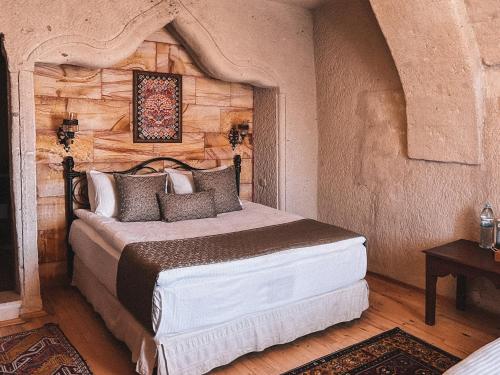 Ένα ή περισσότερα κρεβάτια σε δωμάτιο στο Local Cave House Hotel