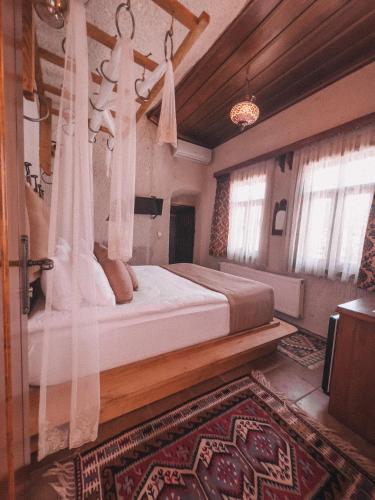 Ένα ή περισσότερα κρεβάτια σε δωμάτιο στο Local Cave House Hotel