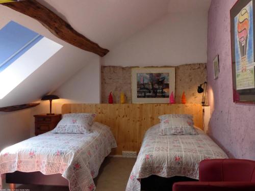 Säng eller sängar i ett rum på La Demeure d'Eugénie