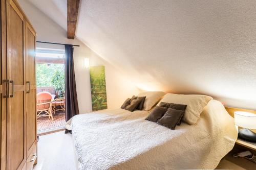 a bedroom with a bed with pillows on it at Villa Suzana's Nature Hideout in Gospić