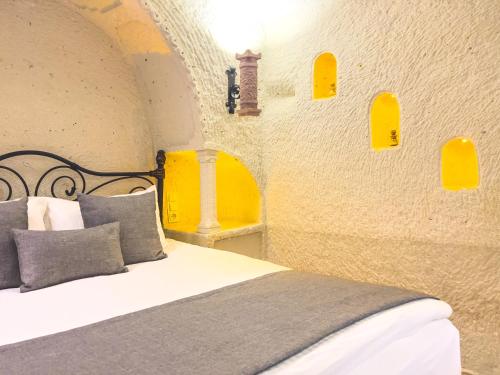 Ένα ή περισσότερα κρεβάτια σε δωμάτιο στο Local Cave House Hotel