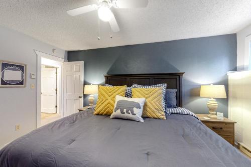 a bedroom with a large bed with yellow and blue walls at Ponderosa 2A Permit #3,01630 in Crested Butte