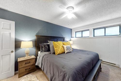 a bedroom with a bed and a ceiling fan at Ponderosa 2A Permit #3,01630 in Crested Butte