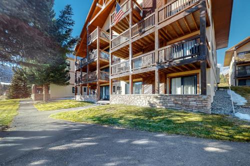 a large apartment building with a pathway in front of it at Ponderosa 2A Permit #3,01630 in Crested Butte