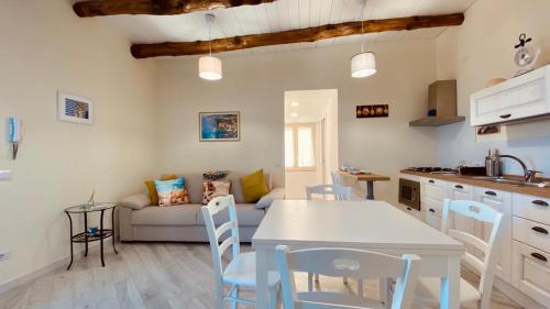 a kitchen and living room with a table and chairs at Suite annarè, casa al mare, casa vacanza al mare in Sorrento