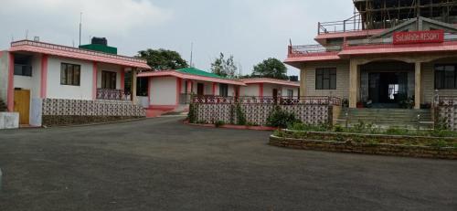 a row of houses in a parking lot at Sulawado Resort in Cherrapunji