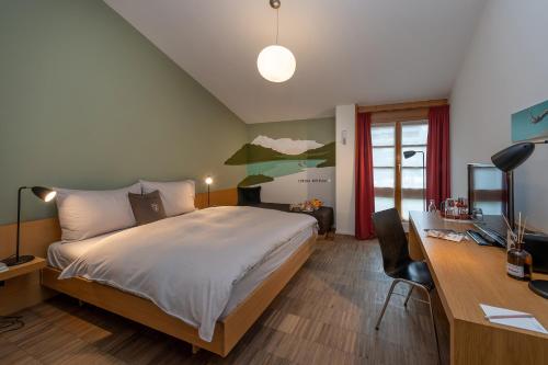 Postel nebo postele na pokoji v ubytování Hotel Schweizerhof Lenzerheide