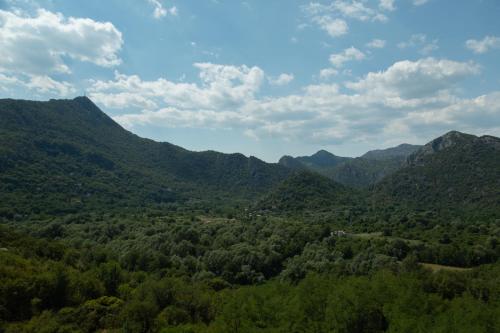 an aerial view of a valley with mountains at Brioni in Virpazar