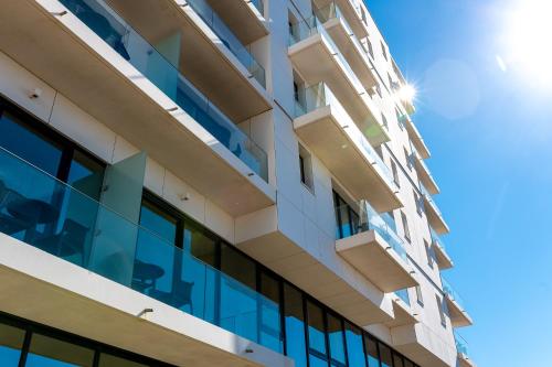 an office building with a lot of windows at Evancy La Marina Boulogne-sur-Mer in Boulogne-sur-Mer