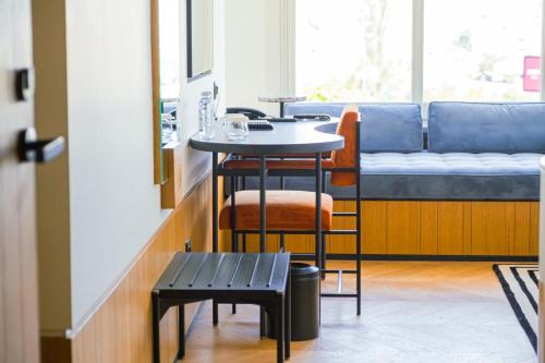 a small table and a bench in a room at The Gift Hotel in Istanbul