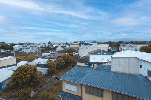 an aerial view of a town with white buildings at Good Times BnB in Chishang